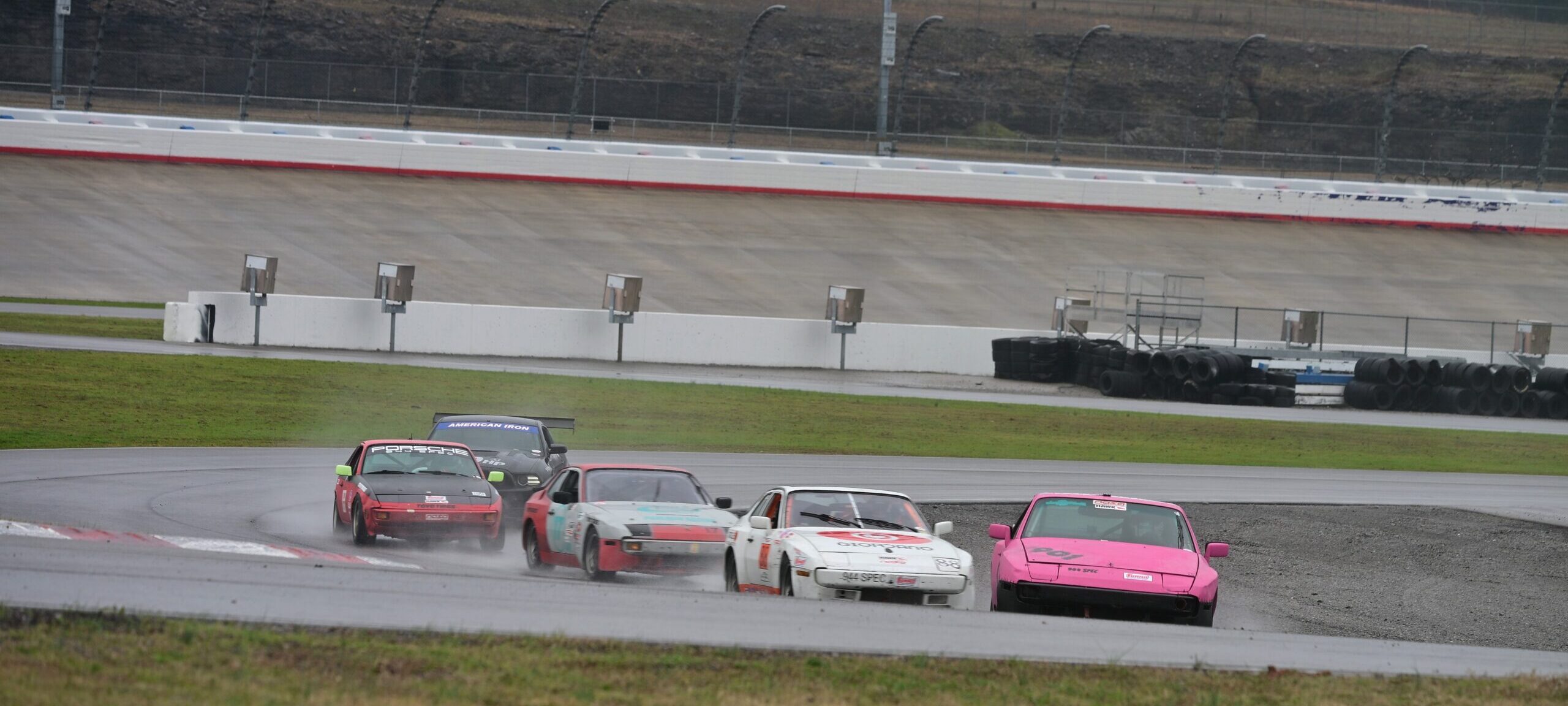 The pink 944 spec leading the pack at Nashville Superspeedway.