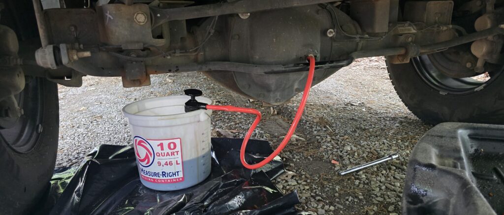 Using a transfer pump to remove the differential fluid on the 2015 4th gen Ram 2500 with the 6.7 Cummins and G56 manual transmission. 