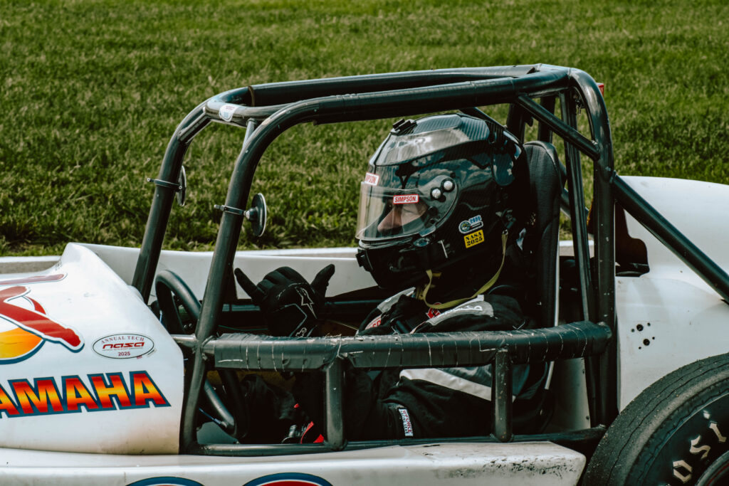 Driver Chris Simmons hanging out on grid in the new Thunder Roadster.