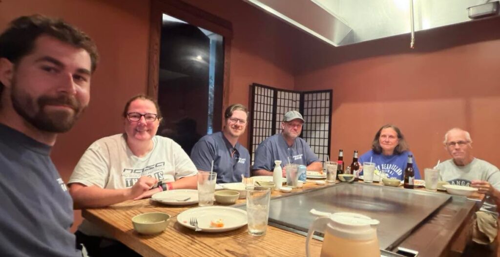 The Dover Endurance Racing team enjoying a much-needed meal after a day on track.,